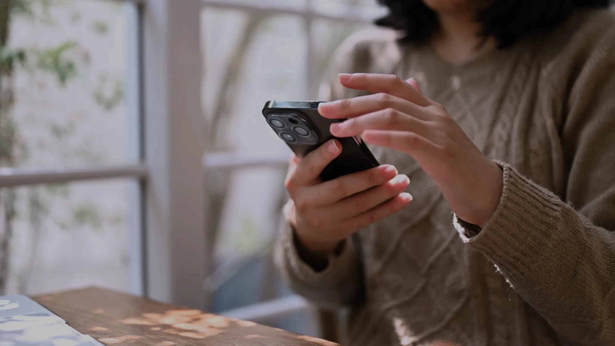 A person holding a mobile phone. 