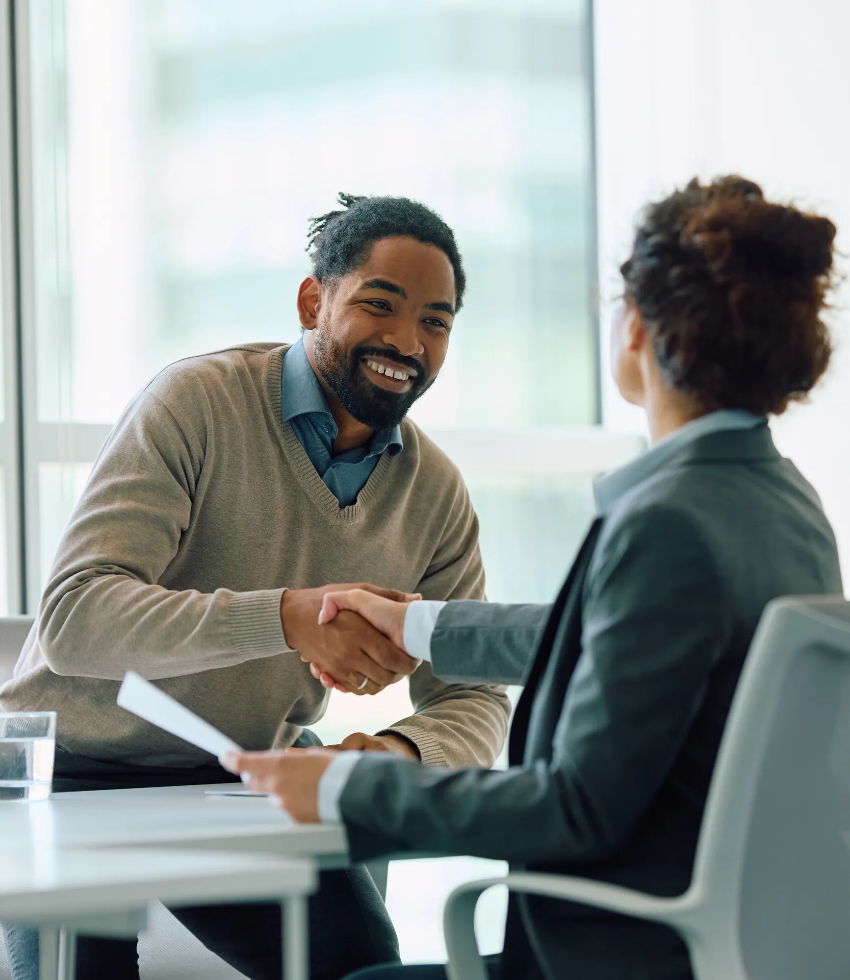 Man shaking a womans hand
