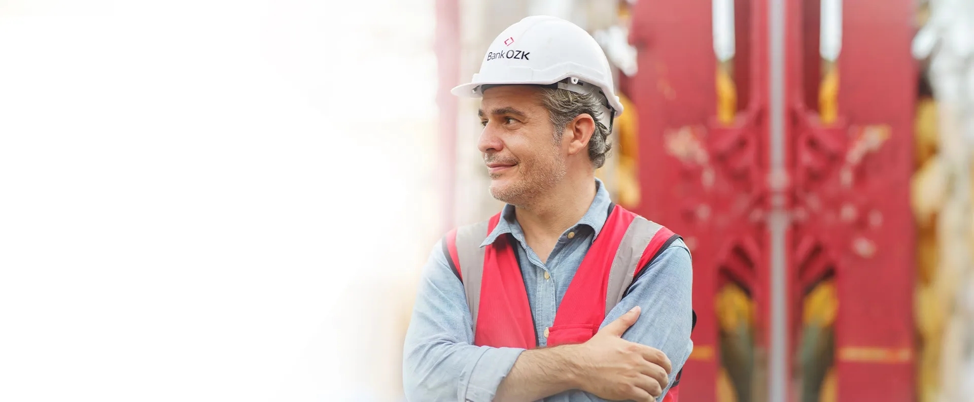 Man wearing a hard hat in a warehouse. Man wearing a hard hat in a warehouse.